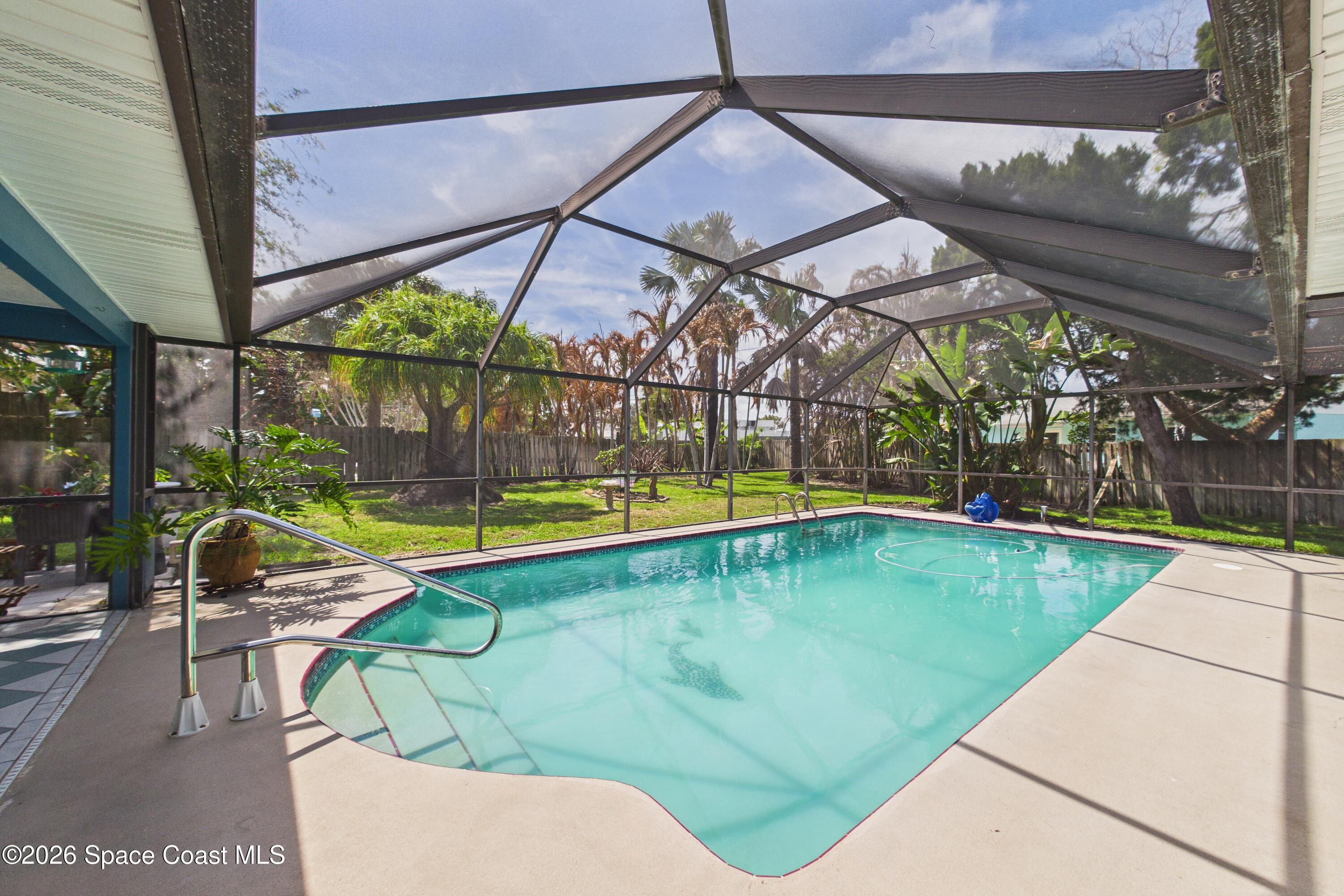 280 Coral Way West Indialantic, FL 32903 - Photo 50 of 72 a view of a backyard with a swimming pool