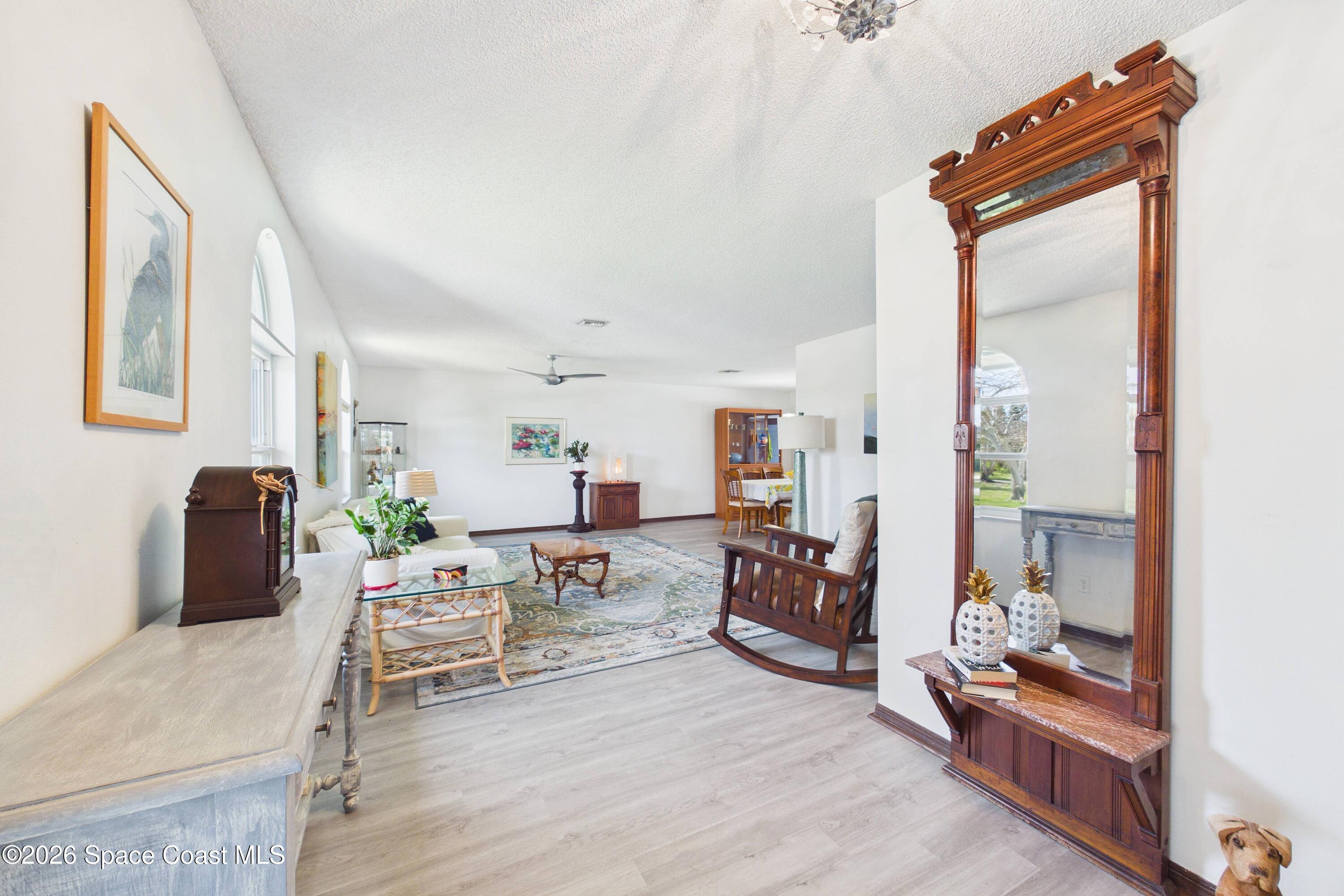 280 Coral Way West Indialantic, FL 32903 - Photo 6 of 72 a living room with furniture and a mirror