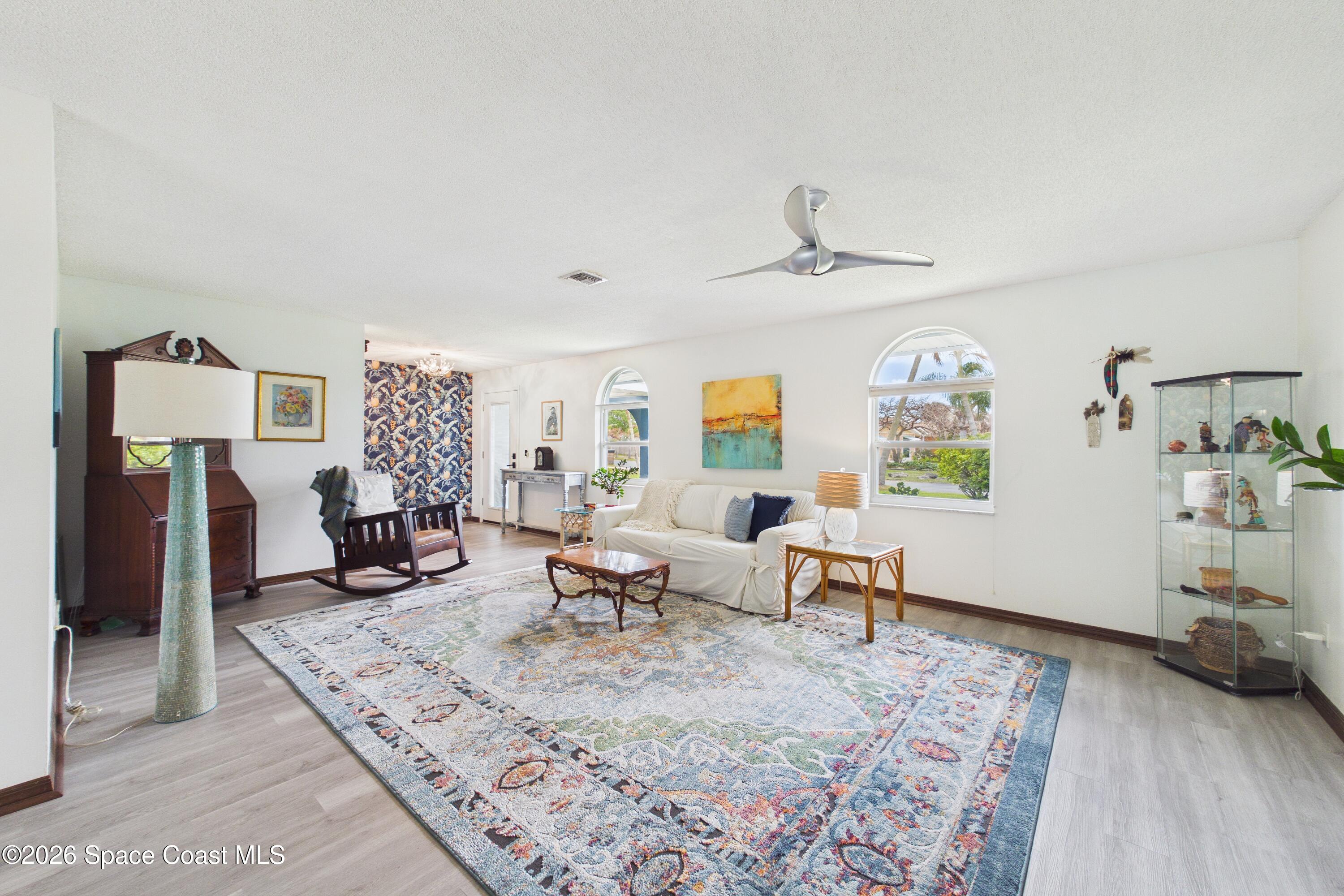 280 Coral Way West Indialantic, FL 32903 - Photo 7 of 72 a living room with furniture rug and window