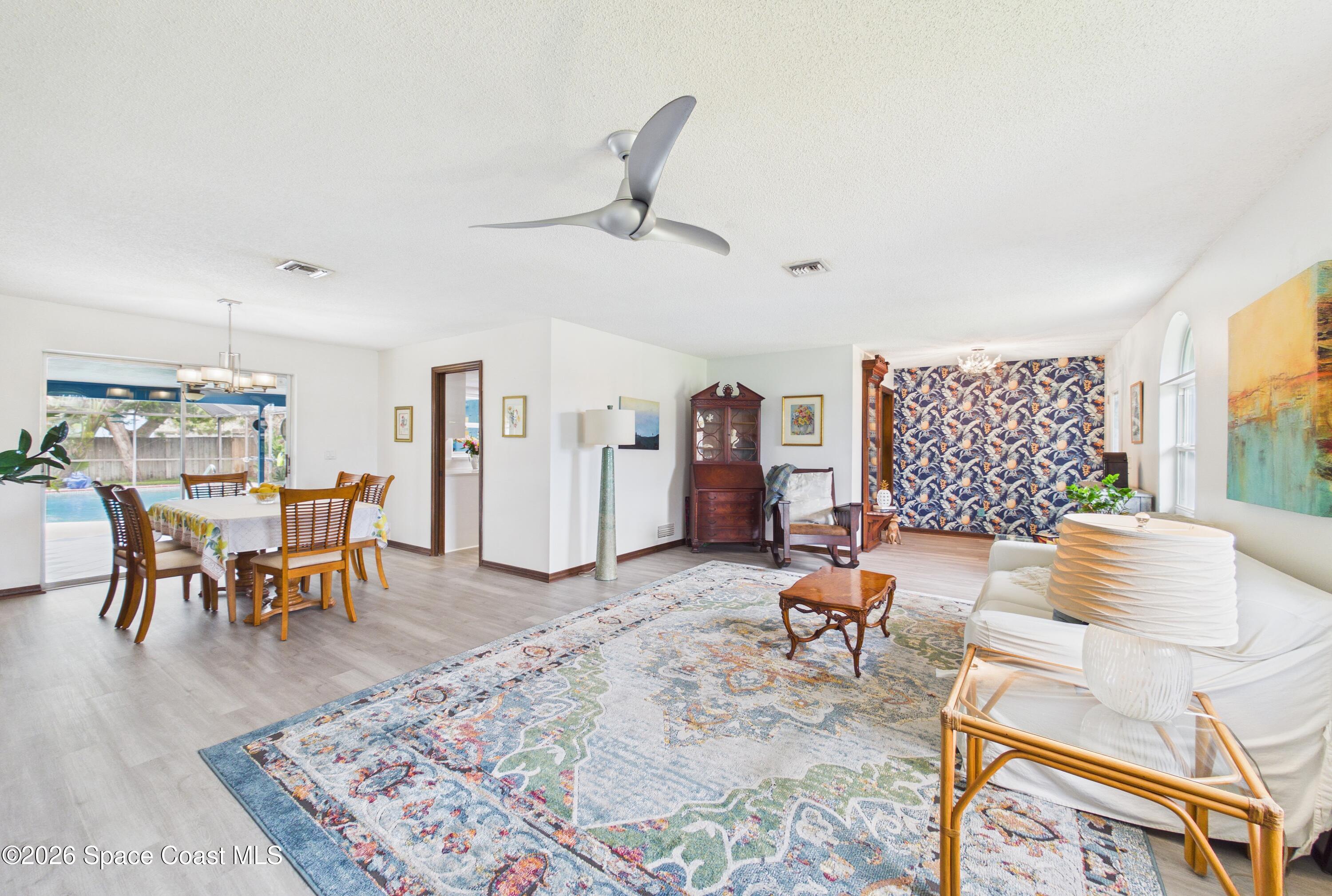 280 Coral Way West Indialantic, FL 32903 - Photo 9 of 72 a living room with furniture and a table