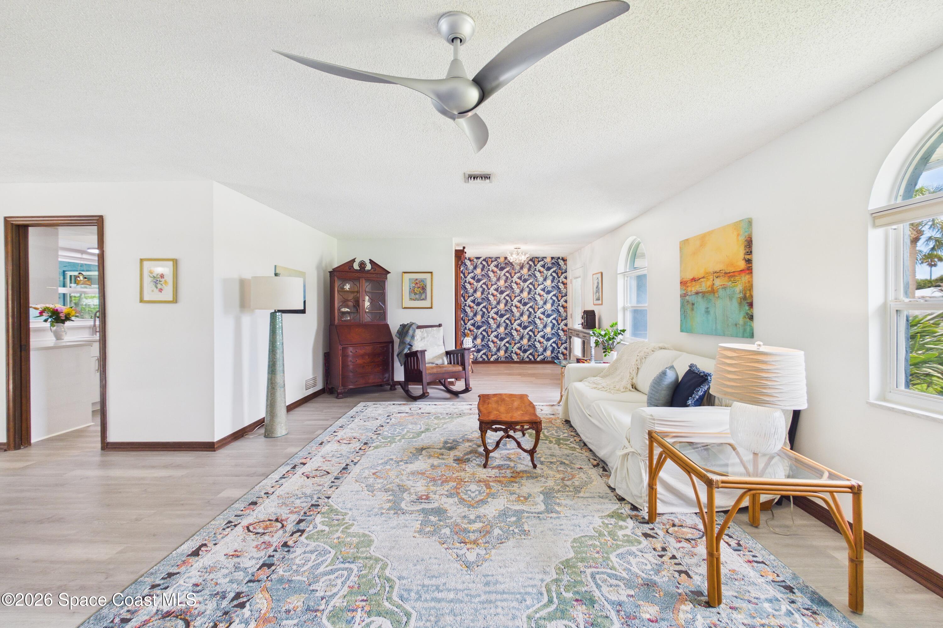 280 Coral Way West Indialantic, FL 32903 - Photo 10 of 72 a living room with furniture and a wooden floor