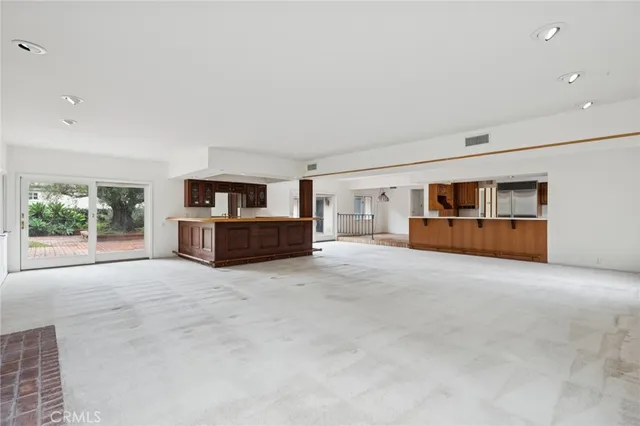 a big room with closet and windows