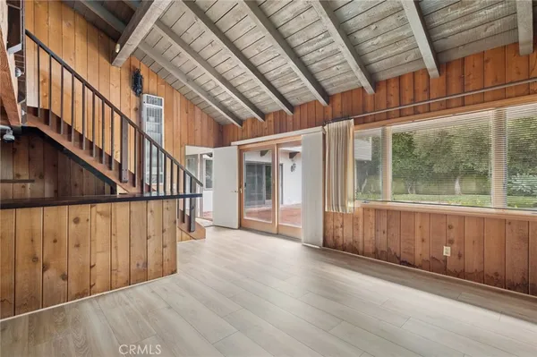 a view of an entryway with wooden floor