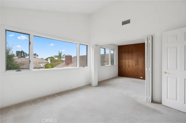 a bathroom with a tub a sink and a large mirror