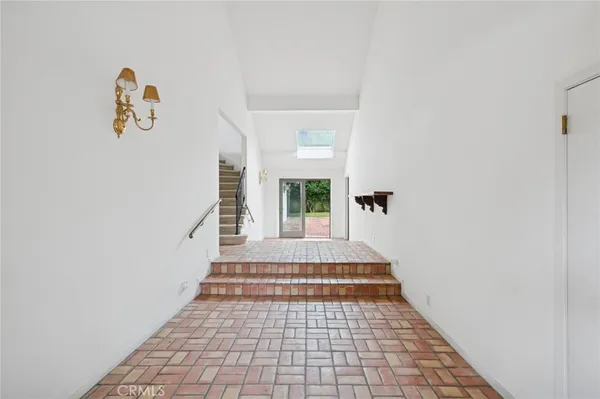 a view of a hallway with windows