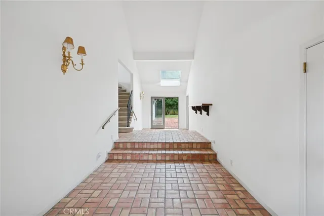 a view of a hallway with windows