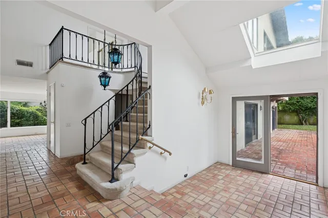 a view of staircase with white walls and windows