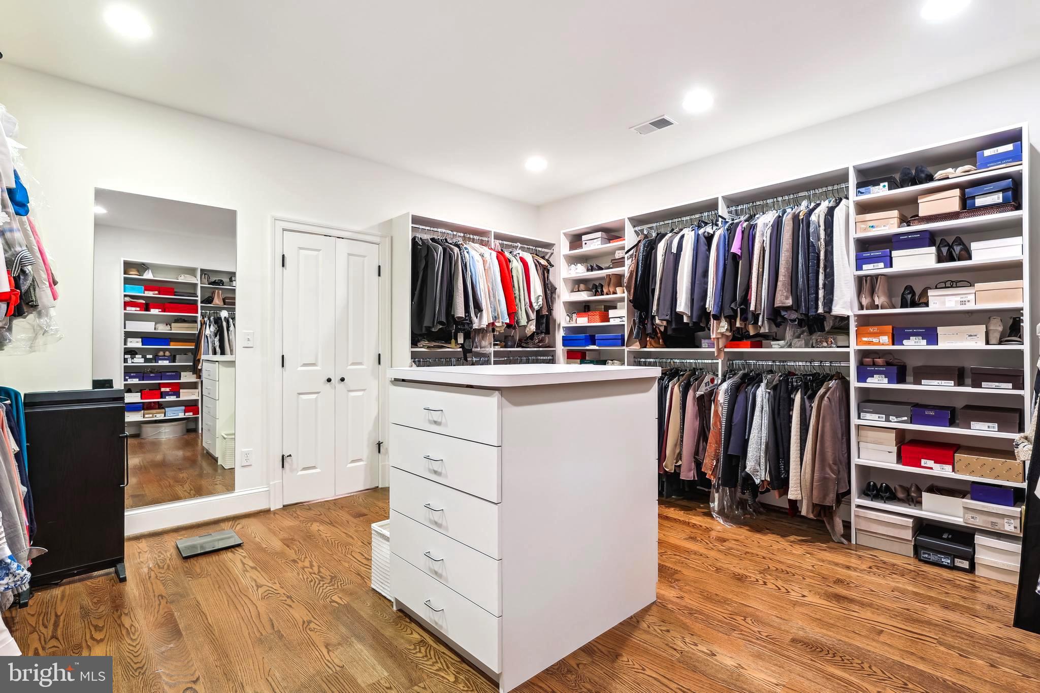 2213 King Place Northwest Washington, DC 20007 - Photo 18 of 40 a view of walk in closet with clothes and shoes