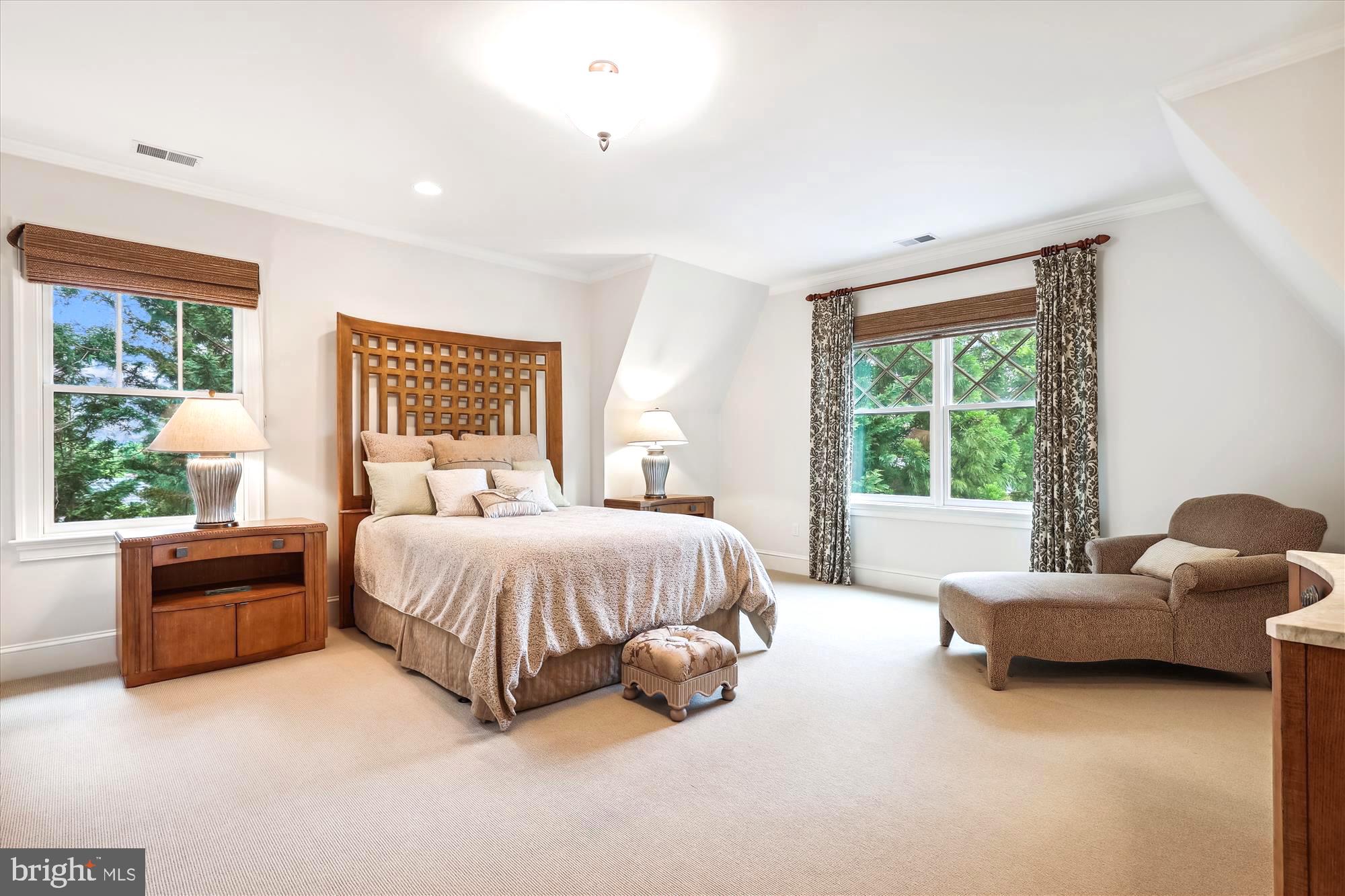 2213 King Place Northwest Washington, DC 20007 - Photo 20 of 40 a spacious bedroom with a bed and a couch