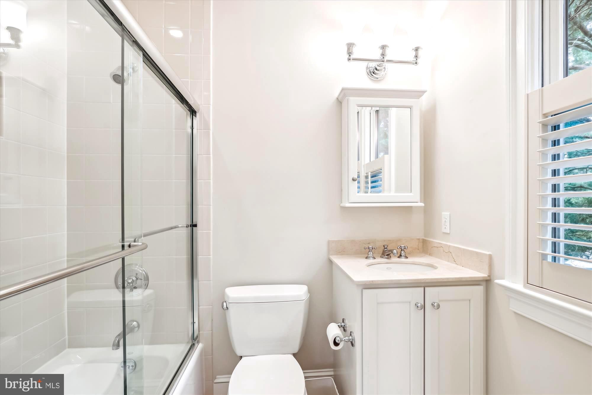 2213 King Place Northwest Washington, DC 20007 - Photo 21 of 40 a bathroom with a sink toilet and shower