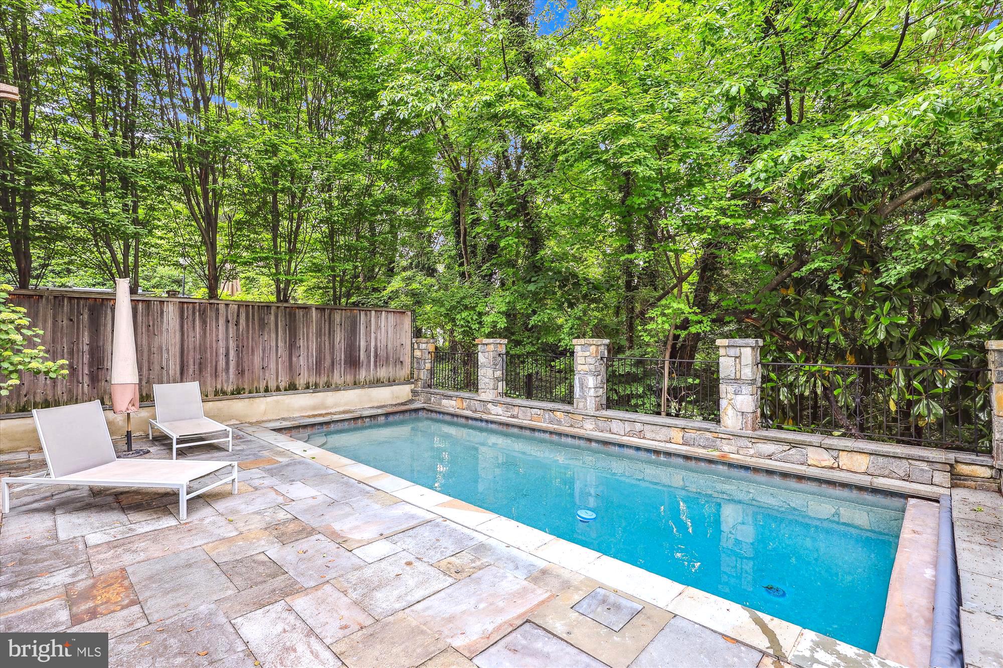 2213 King Place Northwest Washington, DC 20007 - Photo 37 of 40 a view of a chair and tables in the backyard