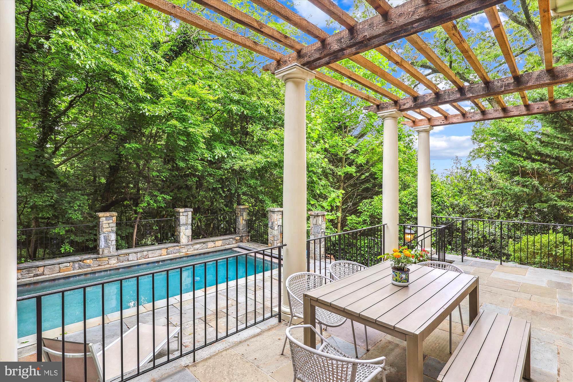 2213 King Place Northwest Washington, DC 20007 - Photo 38 of 40 a view of a patio with a table chairs and a backyard