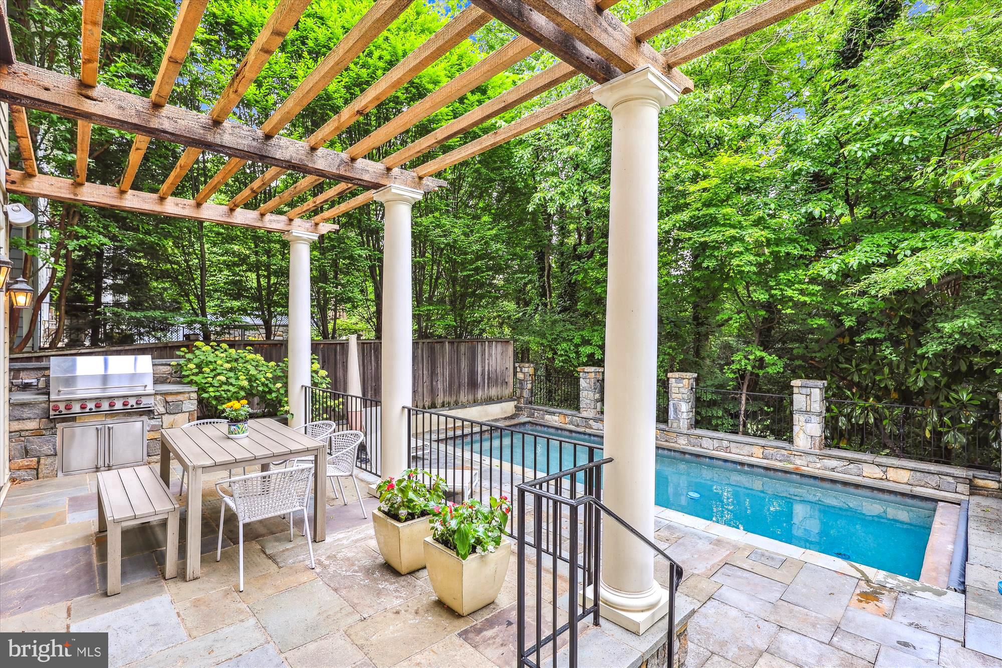 2213 King Place Northwest Washington, DC 20007 - Photo 39 of 40 a view of a patio with a table chairs and a backyard
