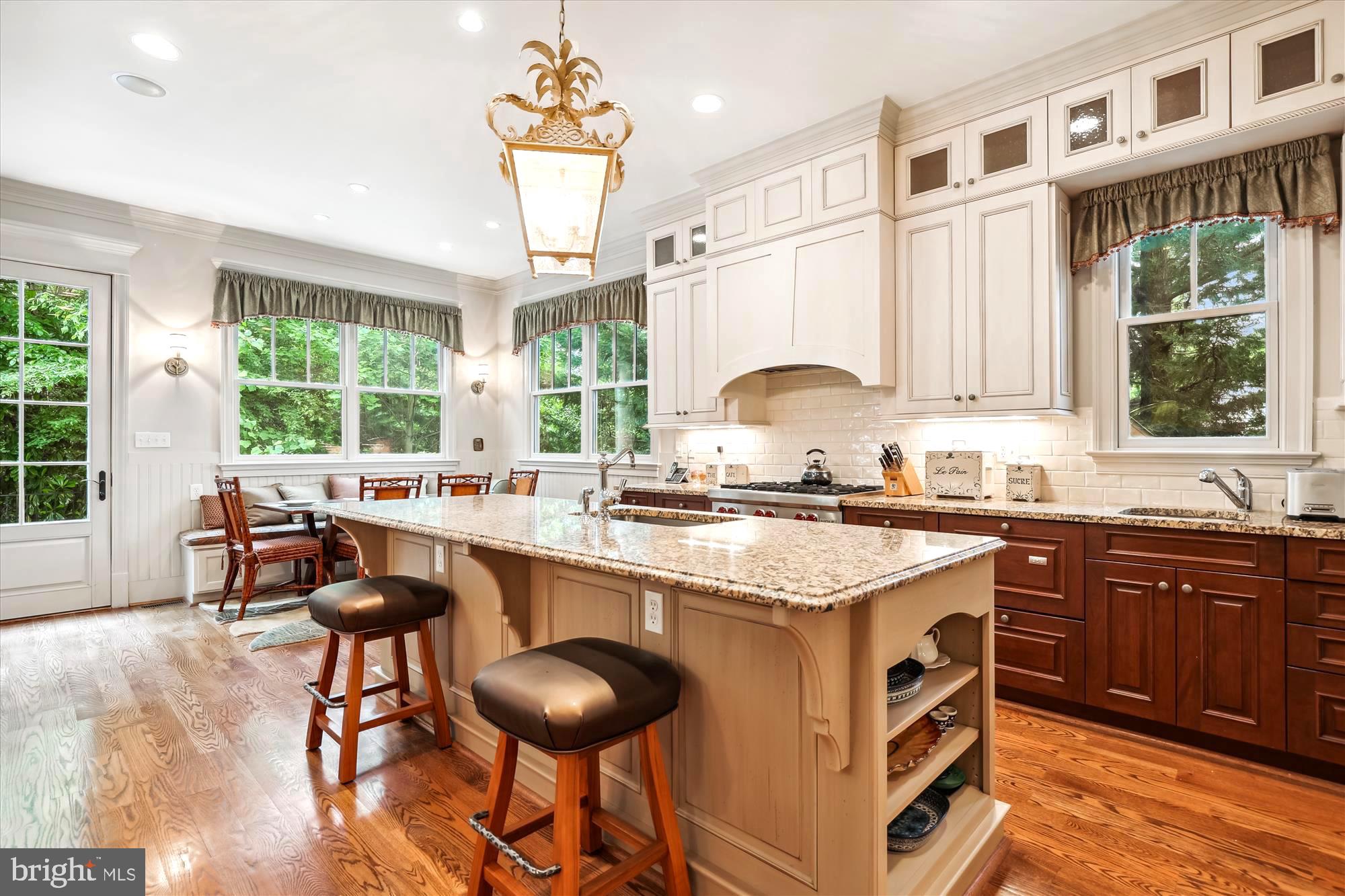 2213 King Place Northwest Washington, DC 20007 - Photo 10 of 40 a kitchen with stainless steel appliances granite countertop a stove a sink and a refrigerator