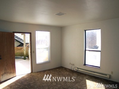 211 East 3rd Street Aberdeen, WA 98520 - Photo 13 of 27 an empty room with windows