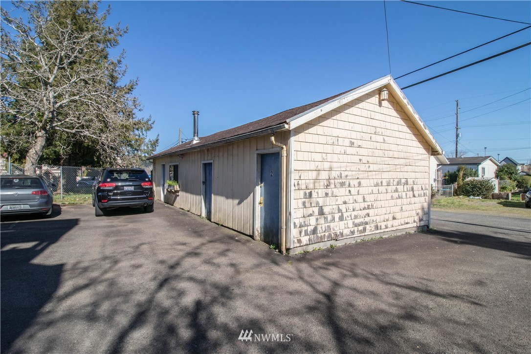 211 East 3rd Street Aberdeen, WA 98520 - Photo 9 of 27 a view of a house with a garage