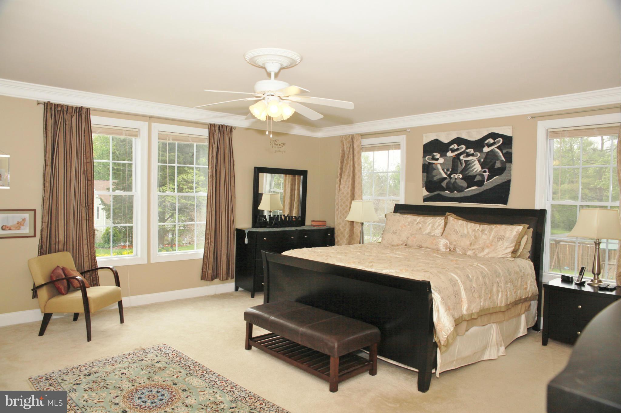 5313 Franconia Road Alexandria, VA 22310 - Photo 22 of 29 a bedroom with a bed and a chandelier
