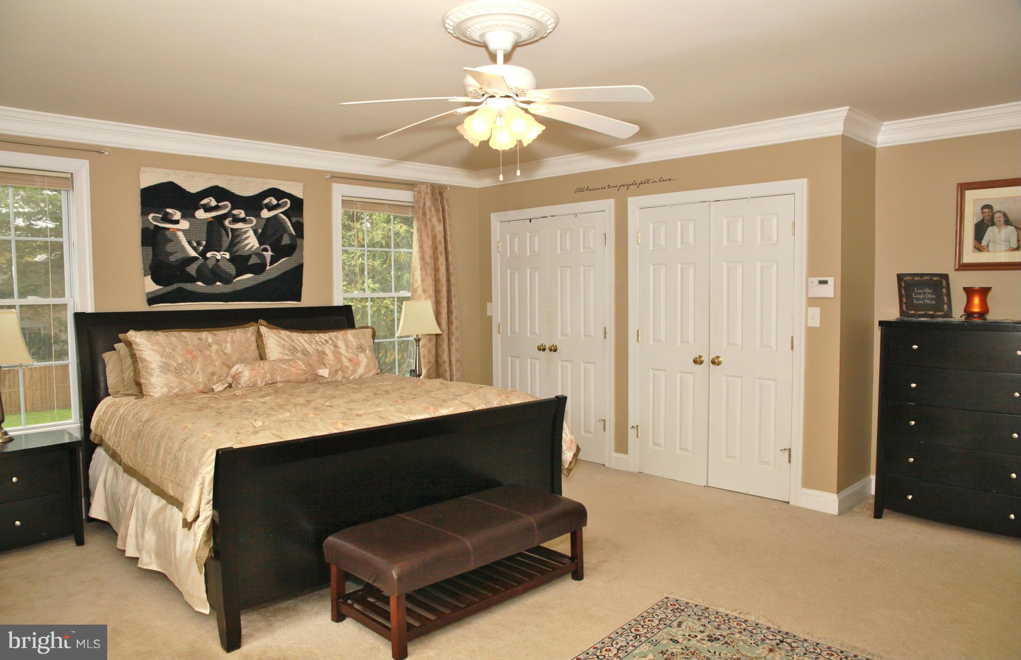 5313 Franconia Road Alexandria, VA 22310 - Photo 24 of 29 a bedroom with a bed and wall painting