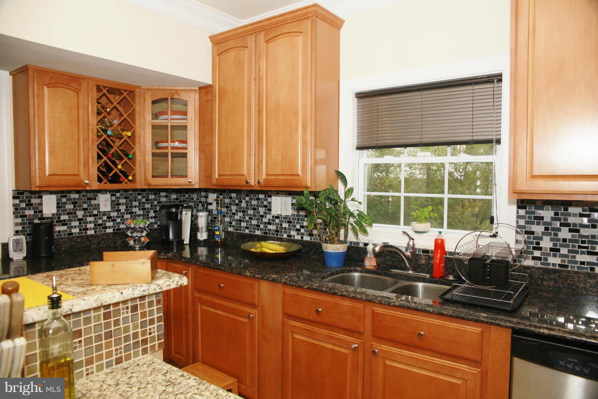 5313 Franconia Road Alexandria, VA 22310 - Photo 6 of 29 a kitchen with stainless steel appliances granite countertop a sink and a granite counter tops with a large window