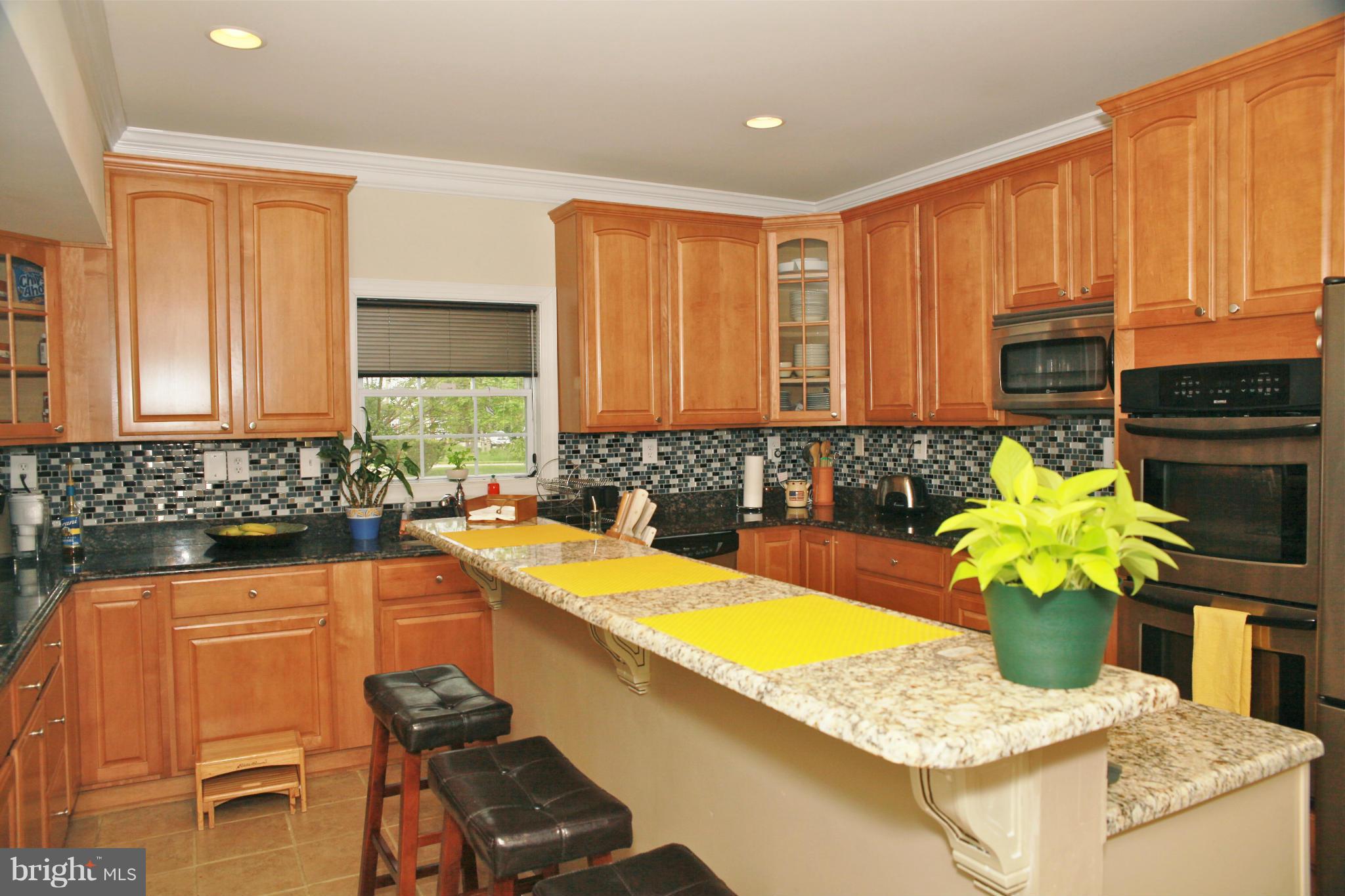 5313 Franconia Road Alexandria, VA 22310 - Photo 7 of 29 a kitchen with stainless steel appliances granite countertop a sink a stove a counter space and cabinets