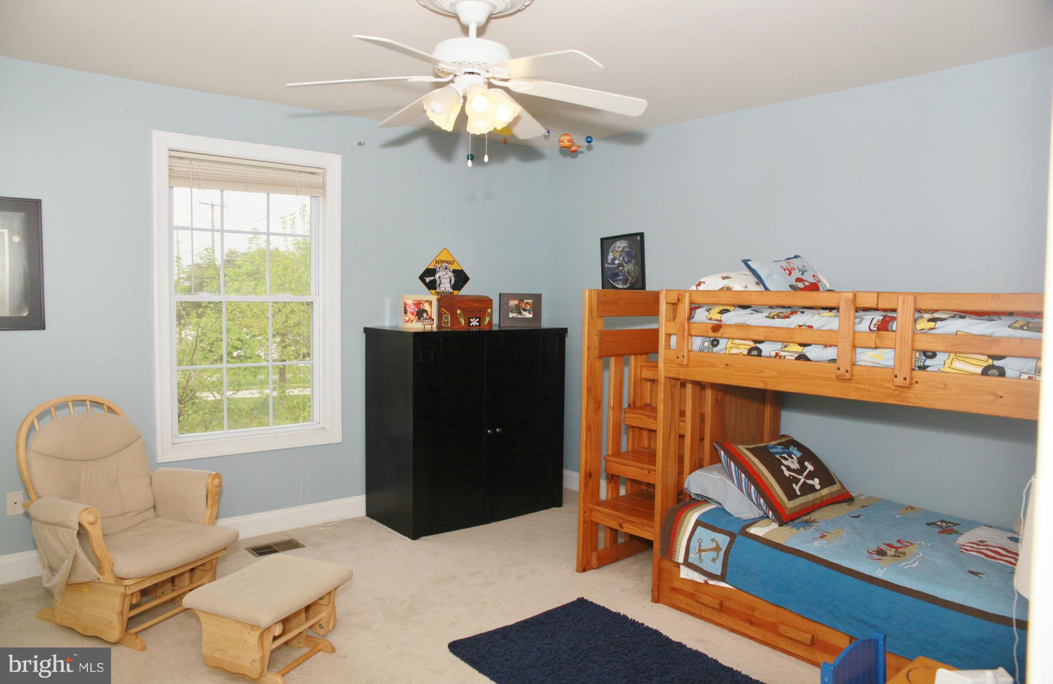 5313 Franconia Road Alexandria, VA 22310 - Photo 9 of 29 a living room with furniture a chandelier and a window