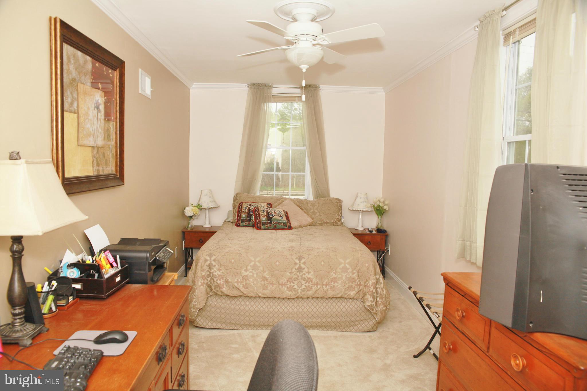 5313 Franconia Road Alexandria, VA 22310 - Photo 10 of 29 a bedroom with a bed and a flat tv screen on dresser