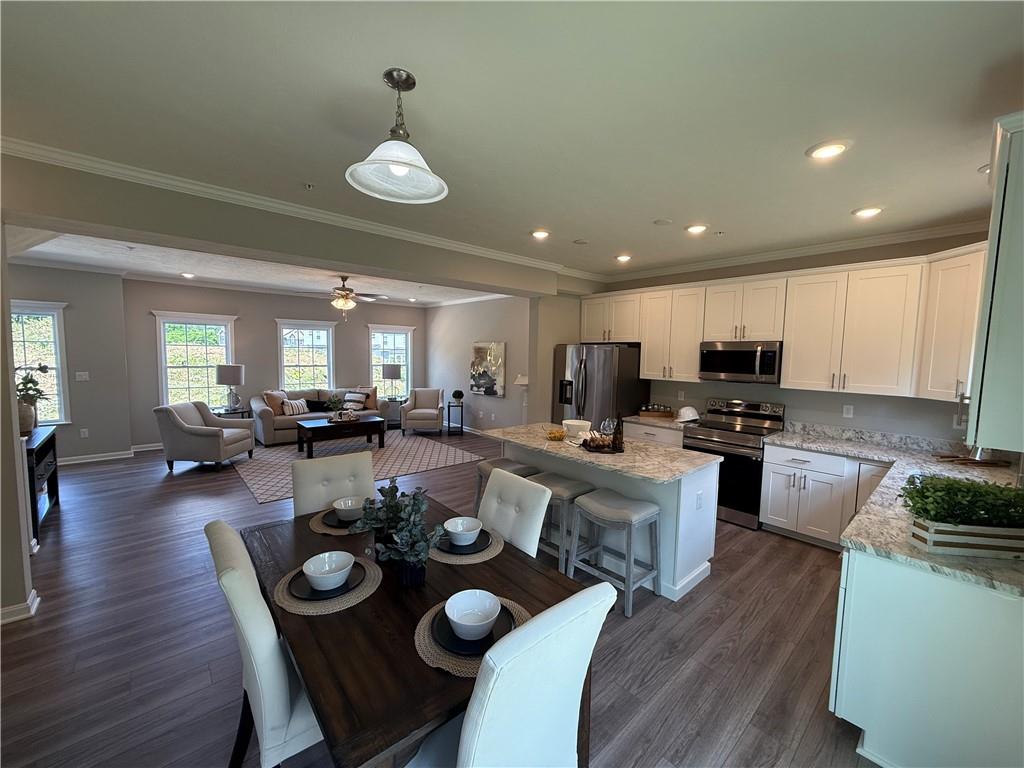 178 Lockheed Drive Coraopolis, PA 15108 - Photo 8 of 22 a open dining room with wooden floor and kitchen view