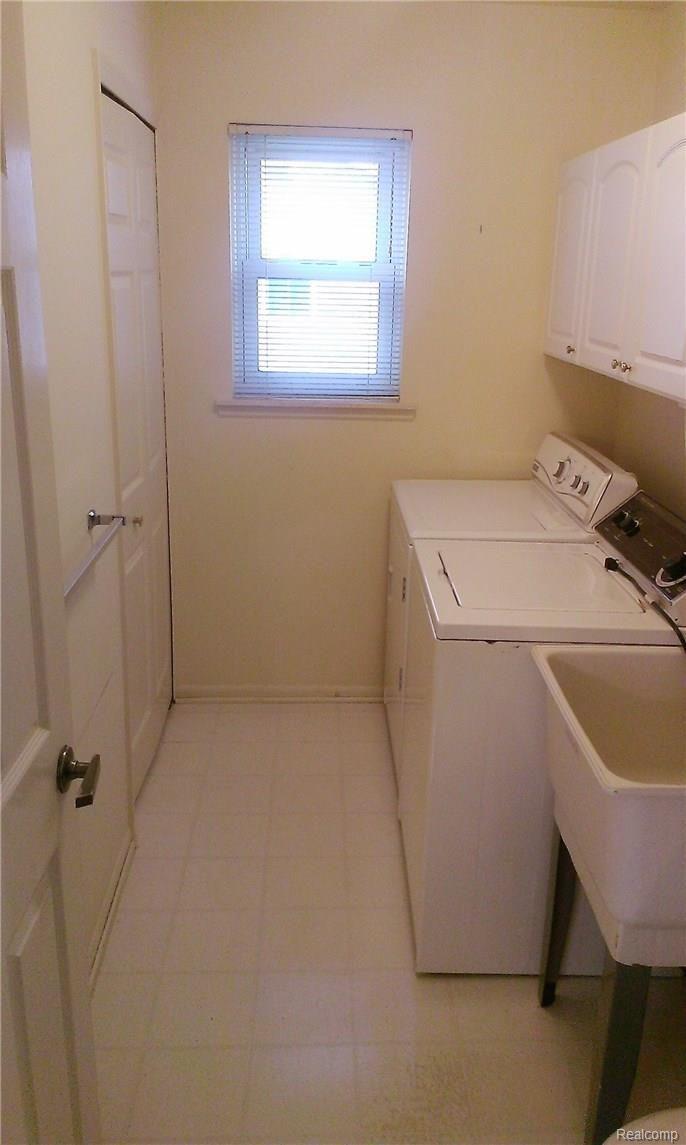 35800 Smithfield Road Farmington, MI 48335 - Photo 24 of 33 First Floor Laundry with deep storage closet and over-head cabinets.