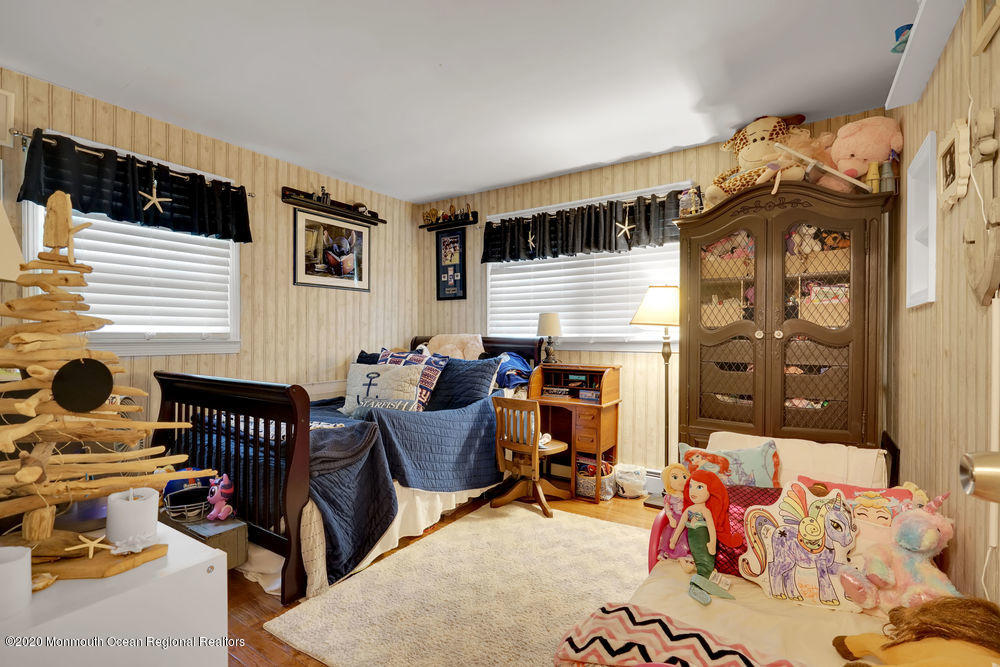 223 Delaware Avenue Oakhurst, NJ 07755 - Photo 16 of 30 a bedroom with furniture and a window