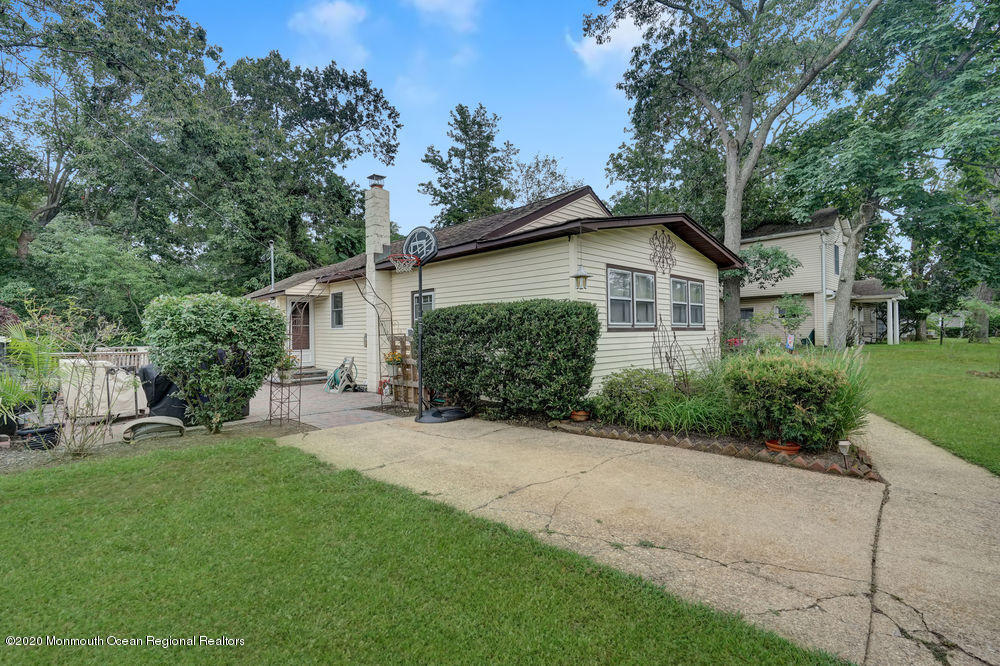 223 Delaware Avenue Oakhurst, NJ 07755 - Photo 18 of 30 a view of a house with a yard and potted plants