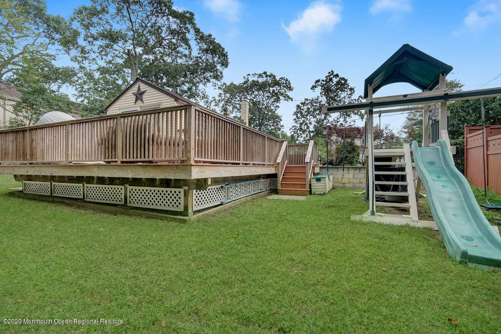 223 Delaware Avenue Oakhurst, NJ 07755 - Photo 24 of 30 a view of a house with a yard and sitting area