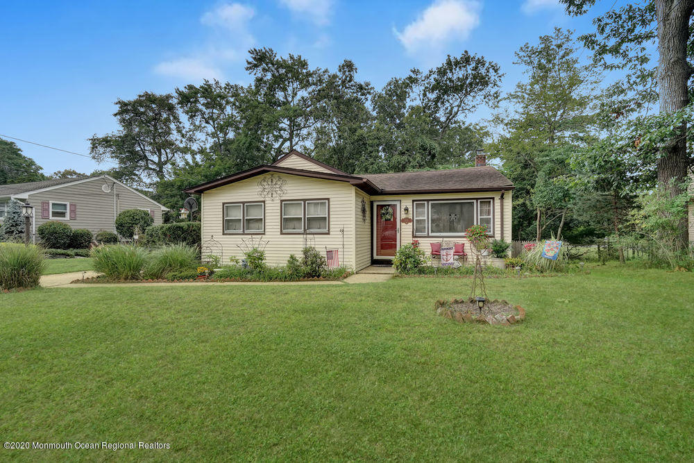 223 Delaware Avenue Oakhurst, NJ 07755 - Photo 3 of 30 a view of a house with a yard and trees