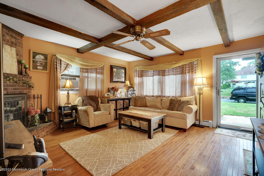 223 Delaware Avenue Oakhurst, NJ 07755 - Photo 5 of 30 a living room with furniture and wooden floor