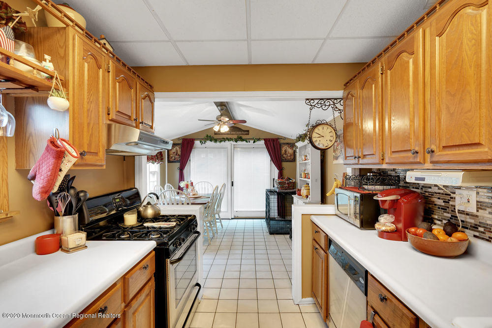 223 Delaware Avenue Oakhurst, NJ 07755 - Photo 6 of 30 a kitchen with a sink appliances and cabinets