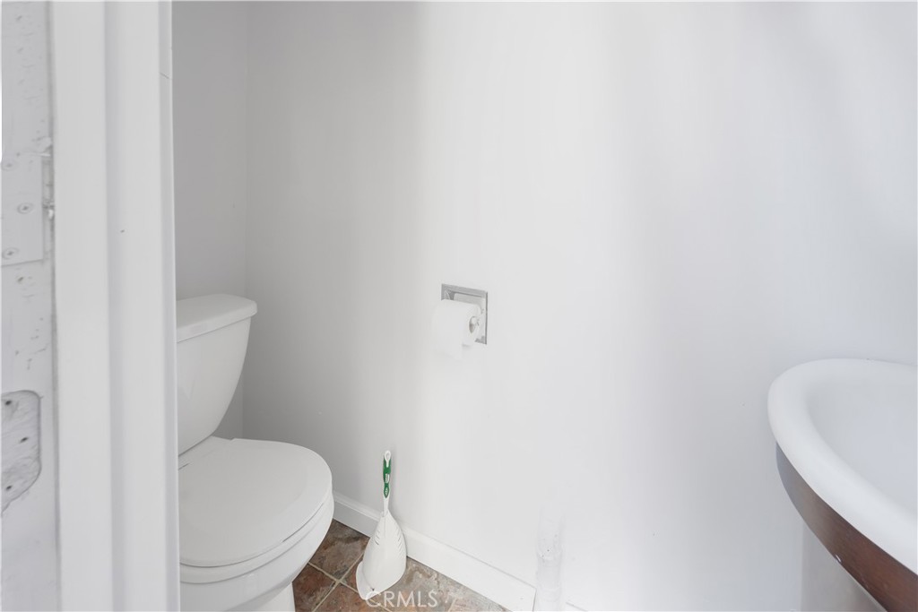 26890 Highway 189 Blue Jay, CA 92317 - Photo 22 of 46 a white toilet sitting next to a white tub