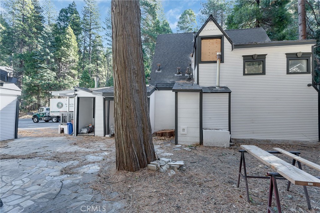26890 Highway 189 Blue Jay, CA 92317 - Photo 23 of 46 a view of a house with backyard and a tree