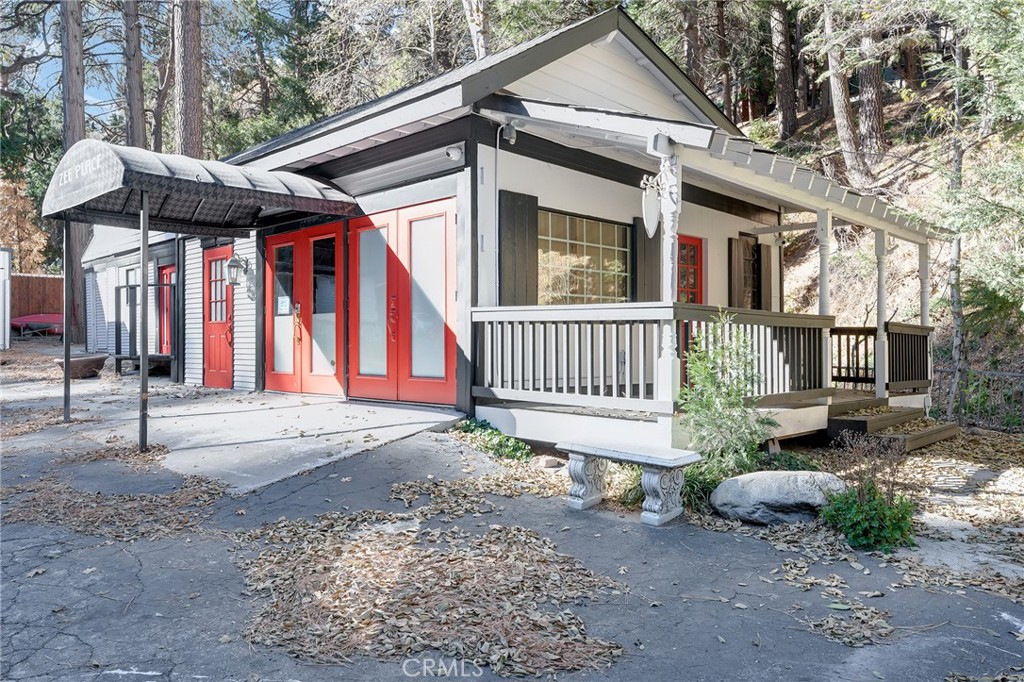 26890 Highway 189 Blue Jay, CA 92317 - Photo 4 of 46 a front view of a house with a yard
