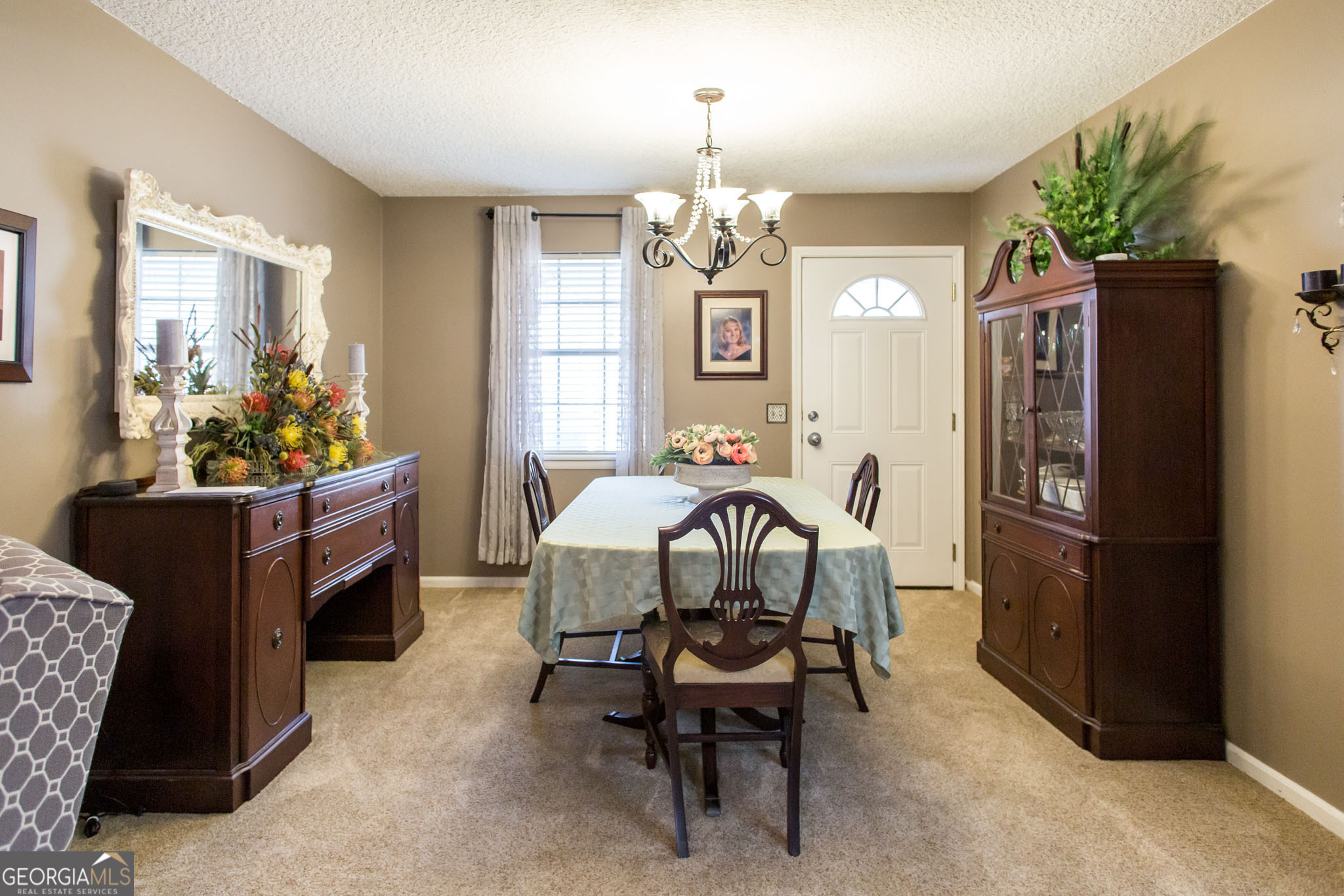 5084 White Hall Church Road Waycross, GA 31503 - Photo 14 of 41 a view of a dining room with furniture and a chandelier