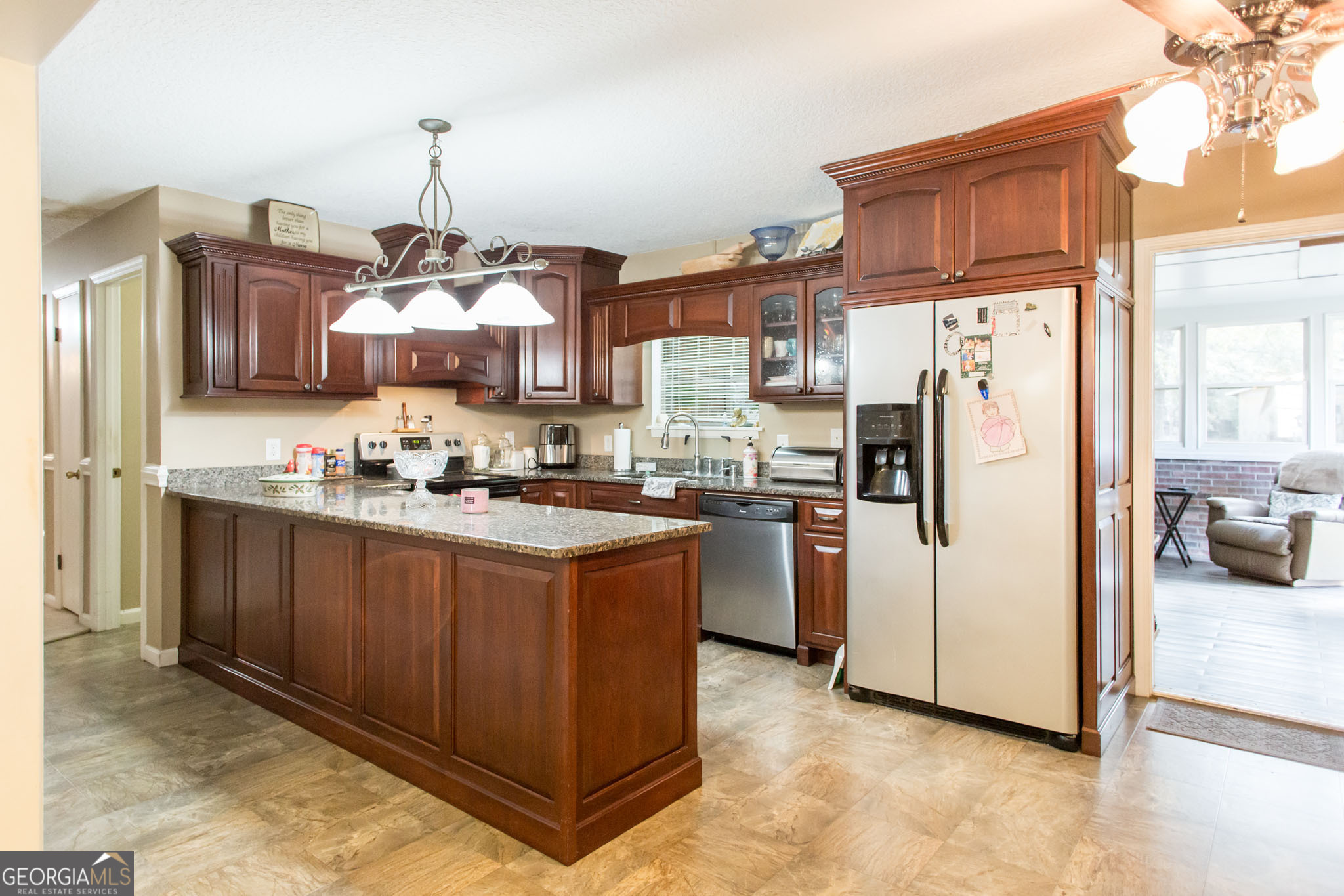 5084 White Hall Church Road Waycross, GA 31503 - Photo 15 of 41 a kitchen with stainless steel appliances granite countertop a refrigerator a stove and a sink