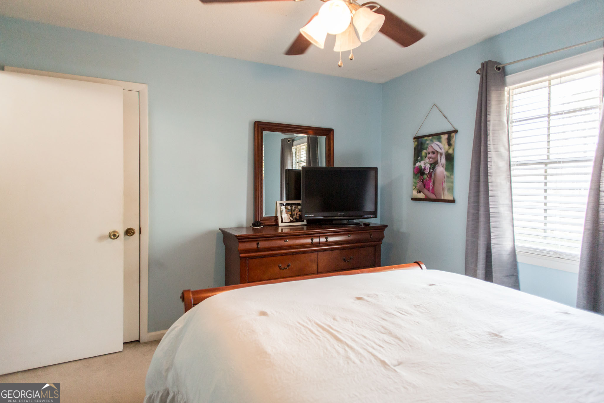 5084 White Hall Church Road Waycross, GA 31503 - Photo 29 of 41 a bedroom with a bed and a flat screen tv