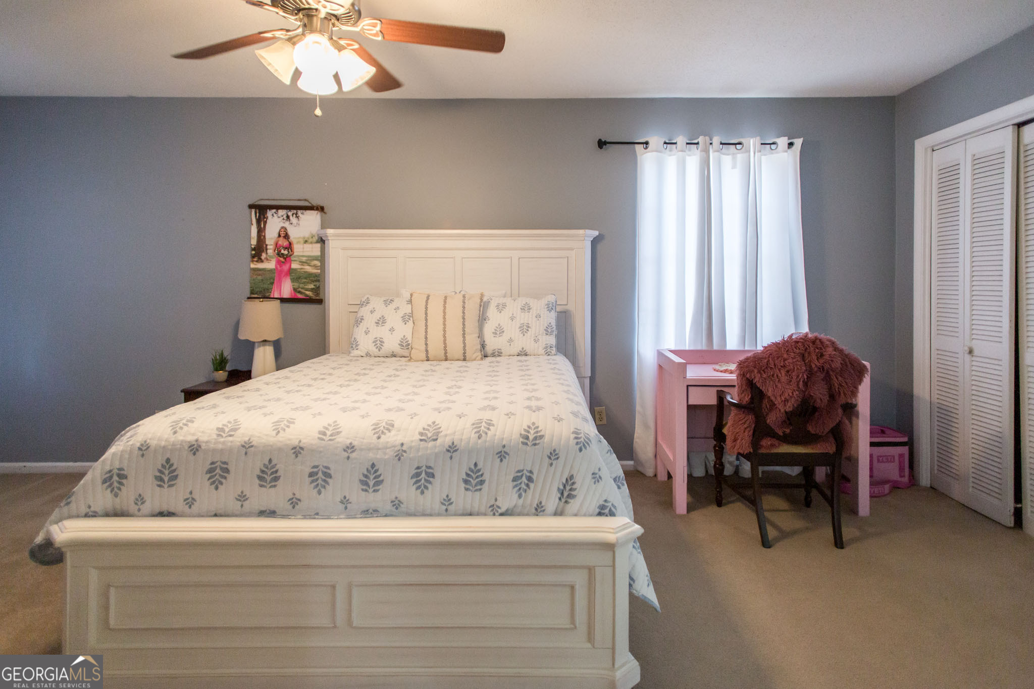 5084 White Hall Church Road Waycross, GA 31503 - Photo 30 of 41 a bedroom with a bed and a chandelier