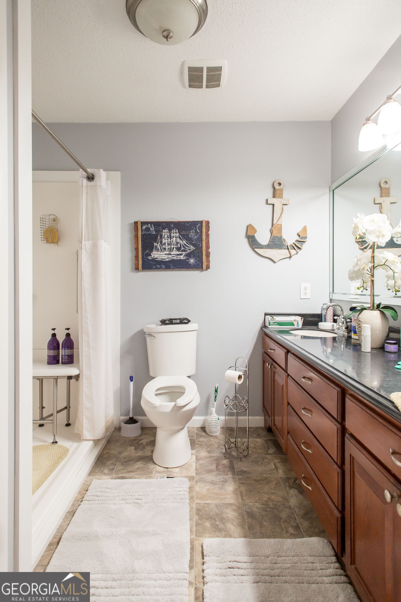 5084 White Hall Church Road Waycross, GA 31503 - Photo 34 of 41 a spacious bathroom with a toilet sink and mirror