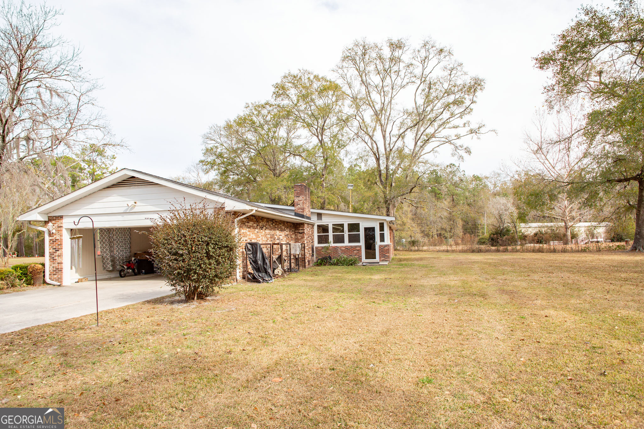 5084 White Hall Church Road Waycross, GA 31503 - Photo 37 of 41 a view of a house with a yard covered in snow