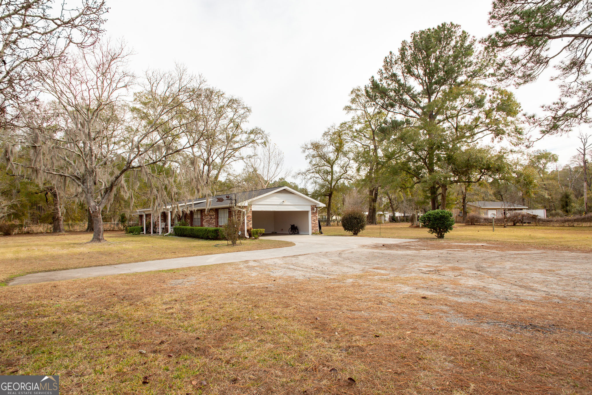 5084 White Hall Church Road Waycross, GA 31503 - Photo 4 of 41 a front view of a house with a yard and garage