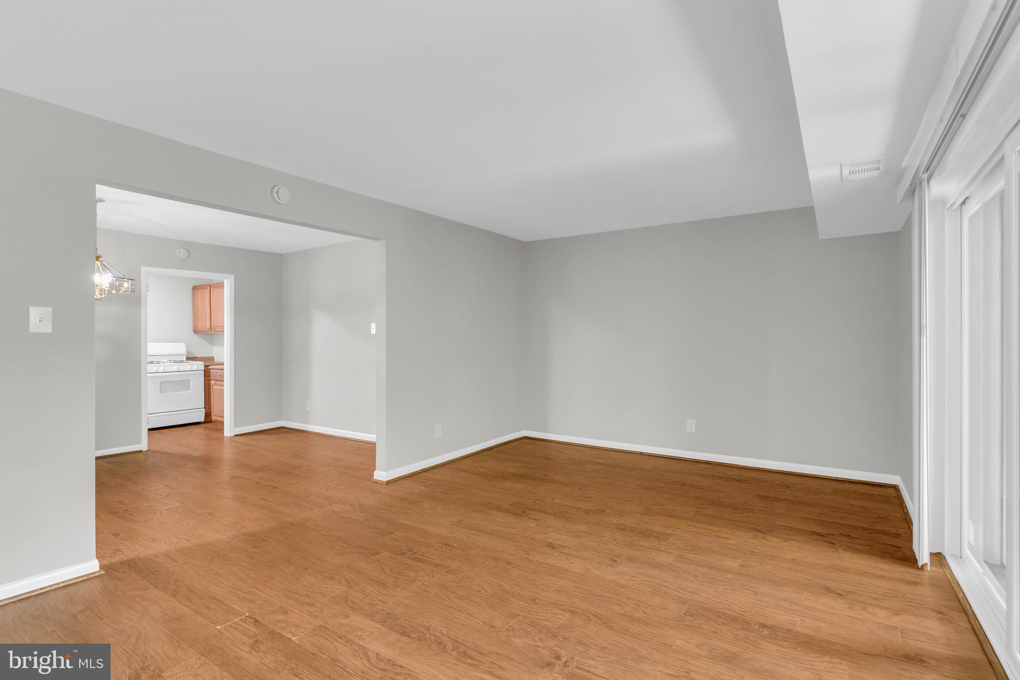 11620 Vantage Hill Road, Unit 22B Reston, VA 20190 - Photo 8 of 24 a view of an empty room and wooden floor