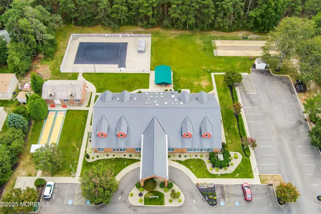 an aerial view of house with yard swimming pool and outdoor seating