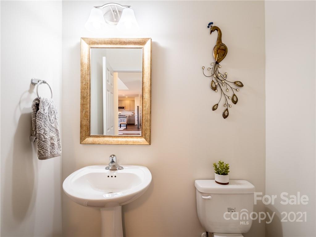 3 Henbit Way Arden, NC 28704 - Photo 13 of 46 a bathroom with a sink toilet and mirror