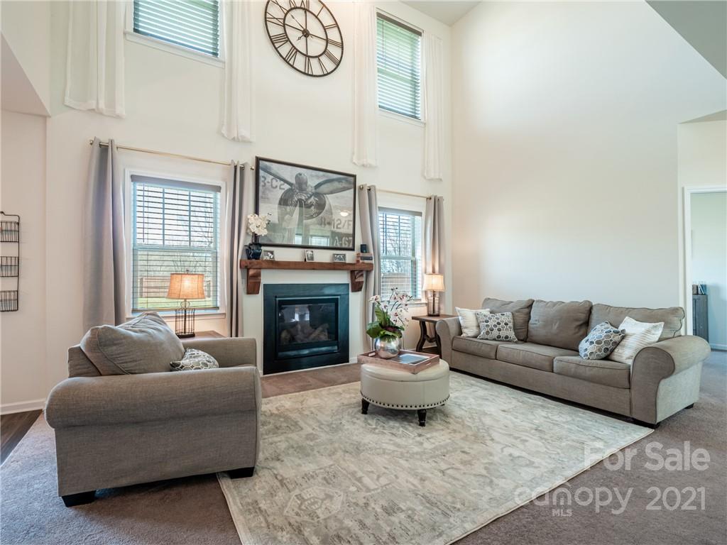 3 Henbit Way Arden, NC 28704 - Photo 18 of 46 a living room with furniture and a fireplace
