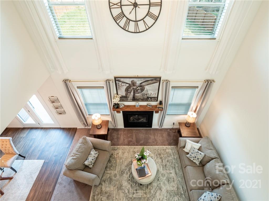 3 Henbit Way Arden, NC 28704 - Photo 20 of 46 a living room with furniture a fireplace and a window