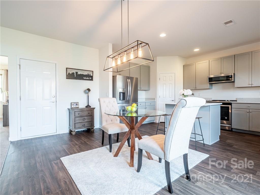 3 Henbit Way Arden, NC 28704 - Photo 22 of 46 a view of kitchen with cabinets and wooden floor